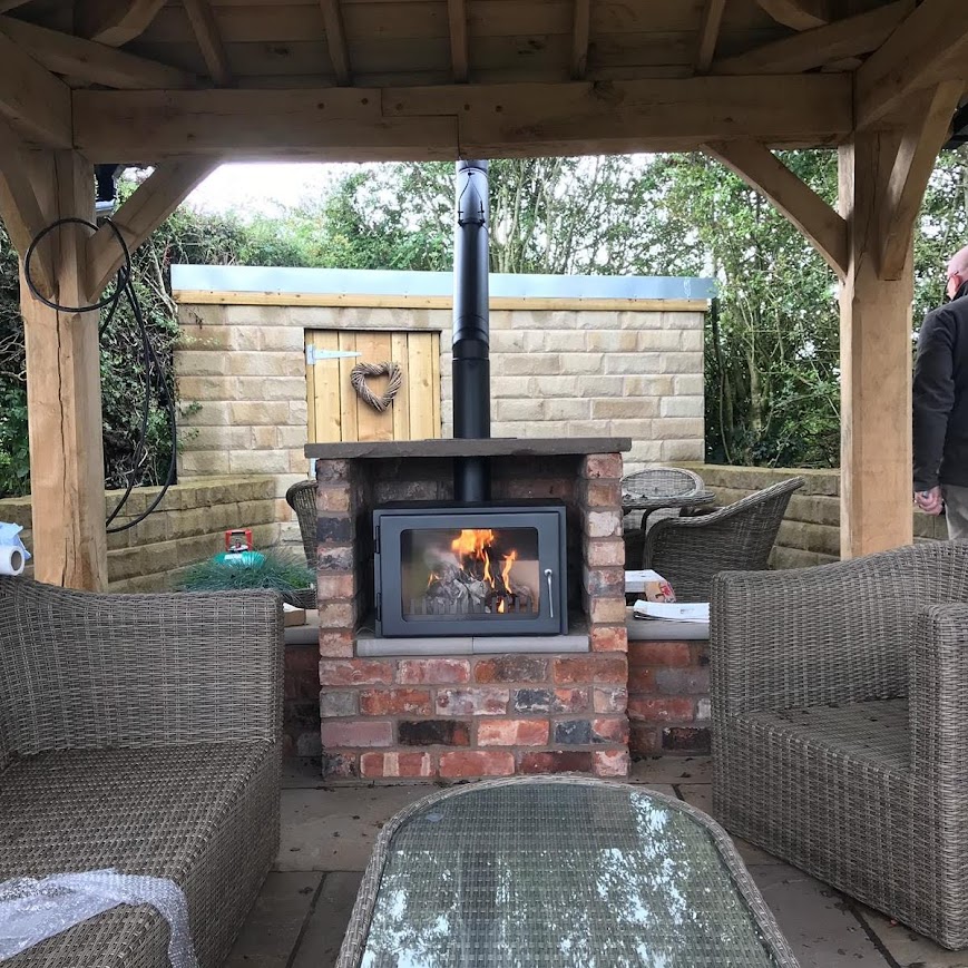 Outdoor stove built into firteplace