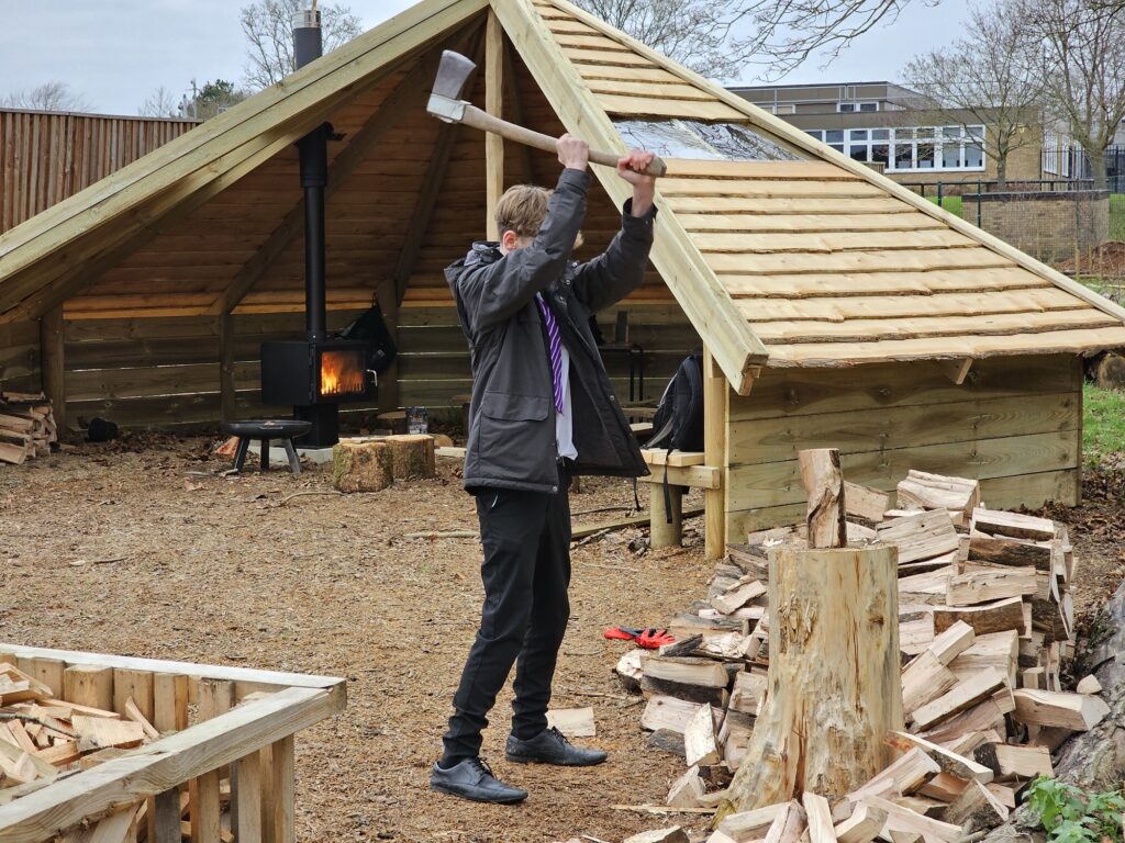 Forest School Fire activities - chopping firewood