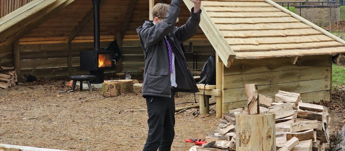Forest School Fire activities - chopping firewood