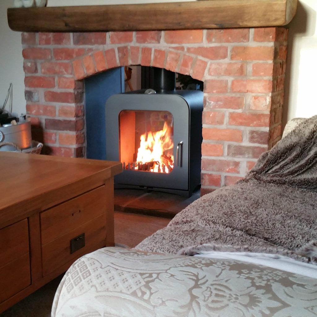 A Double Sided Stove 12kw in modern Brick fireplace